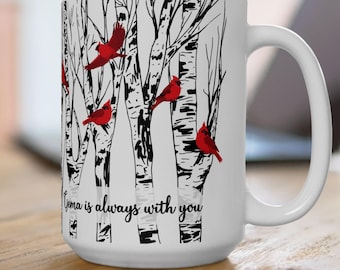 May include: White ceramic mug with a black and white illustration of birch trees and red cardinals. The text "Grandma is always with you" is printed on the mug.