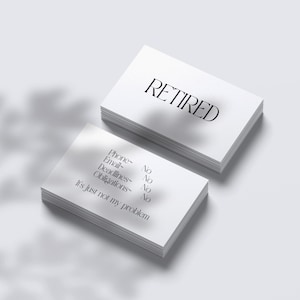 May include: A stack of white business cards with the word "RETIRED" printed on the top card. The bottom card has the text "Phone - No, Email - No, Deadlines - No, Obligations - No, It's just not my problem."