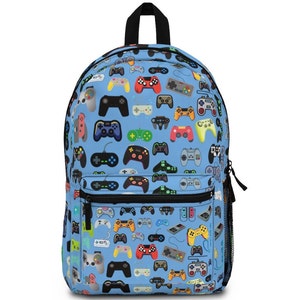 May include: A light blue backpack featuring a pattern of colorful video game controllers. The backpack has a black zipper, a black handle, and a mesh side pocket. The controllers are in various colors and designs.