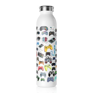 May include: White stainless steel water bottle with a pattern of colourful video game controllers. The controllers are in various shapes and colours, including red, yellow, green, and blue. The bottle has a silver lid.