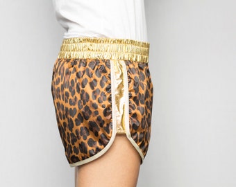 Leopard printed satin shorts elastic belt and jersey sides coated gold laminate bordered bias white gold ZAT GOLD LEO T.S made in France