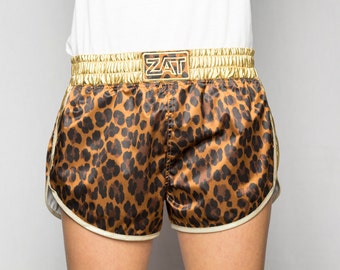 Leopard printed satin shorts elastic waistband and gold lamé coated jersey sides edged in white gold ZAT GOLD LEO T.L 40/42 made in France