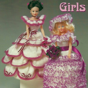 May include: Two dolls in white and pink knitted dresses, with hats and bouquets. The text "Girls" is in pink. The image is a pattern for covering toilet rolls. The pattern uses DK yarn or Craftlon and knit in lace.