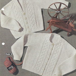 May include: Two white knitted cardigans with button closures and cable knit patterns. The cardigan on the top is labeled "Model A" and the cardigan on the bottom is labeled "Model B".