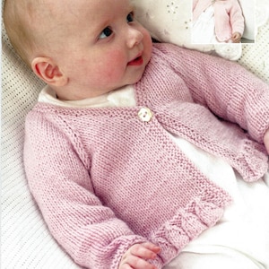 May include: A pink knitted baby cardigan with a button fastening. The cardigan has a ribbed trim around the edges and is made with a soft yarn.