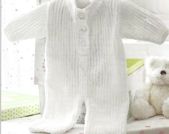 May include: White knitted baby onesie with a button closure. The onesie has a ribbed texture and is hanging on a hanger.
