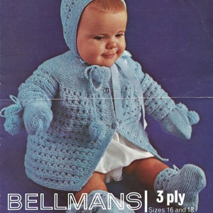 May include: A blue knitted baby outfit with a matching hat, booties, and mittens. The outfit is made with a 3-ply yarn and is available in sizes 16 and 18.