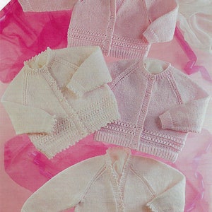 May include: Four knitted baby cardigans in pink and white. The cardigans have a button closure and a delicate lace trim.  Includes premature sizes.