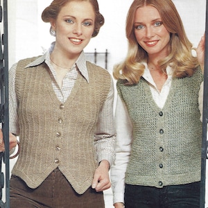 May include: Two women wearing knitted vests. The woman on the left is wearing a brown vest with a V-neck and buttons. The woman on the right is wearing a green vest with a V-neck and buttons.