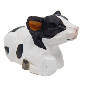 spotted cow figurine