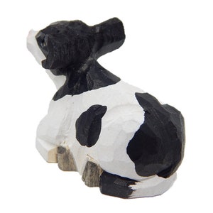 spotted cow figurine