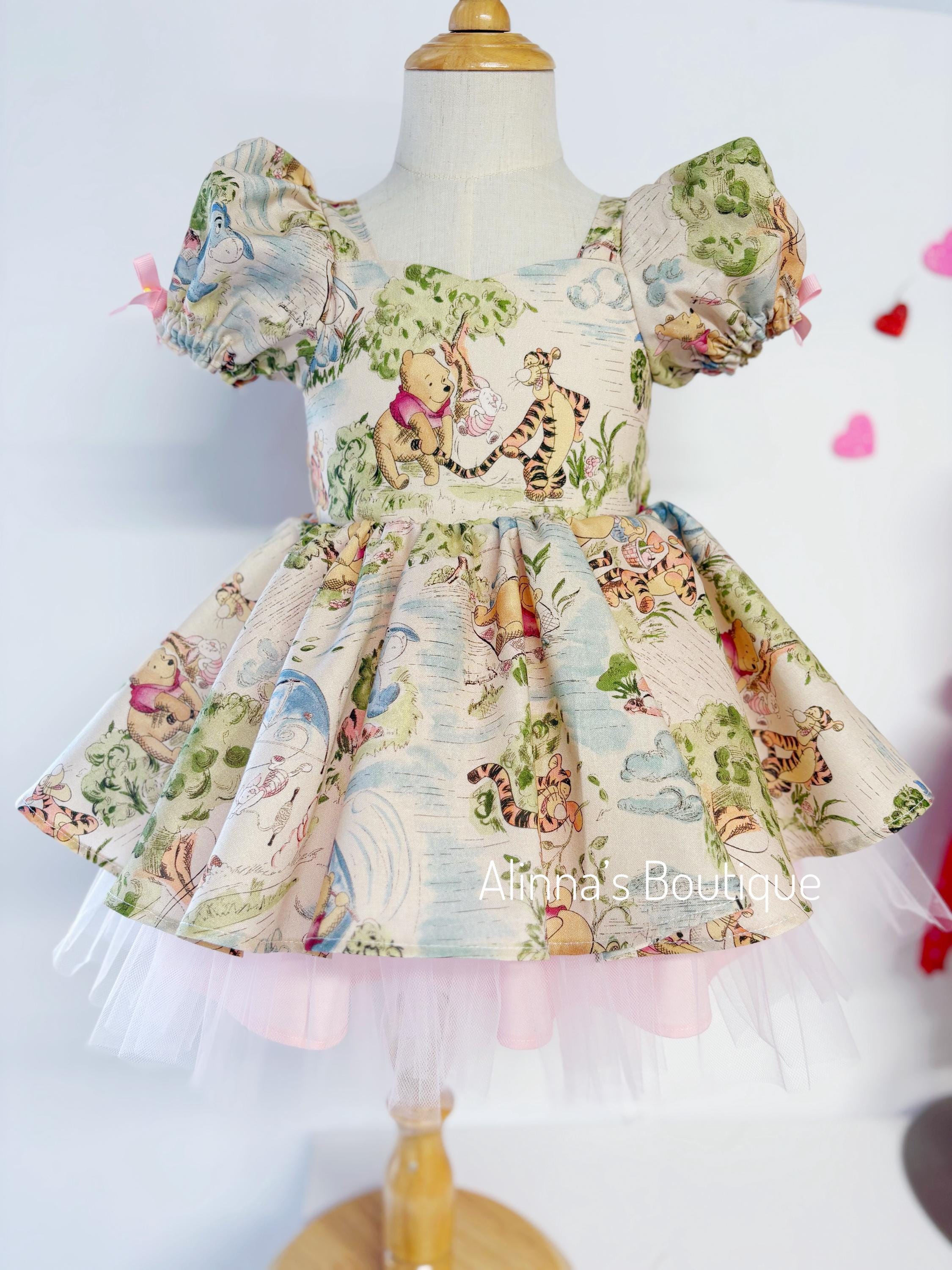 winnie the pooh first birthday dress Winnie the Pooh birthday party dress #firstbirthday The Winnie the Pooh first birthday dress is an adorable and charming ensemble perfect for celebrating a little one's special milestone. Inspired by the beloved