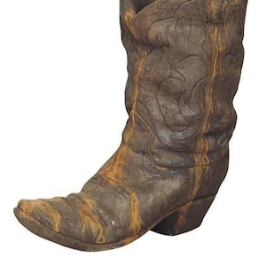 May include: A brown cowboy boot planter with a distressed finish. The boot is made of a durable material and has a classic design.