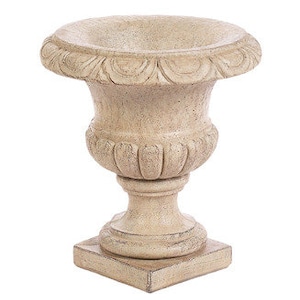 May include: A white ceramic planter with a fluted design and a square base.