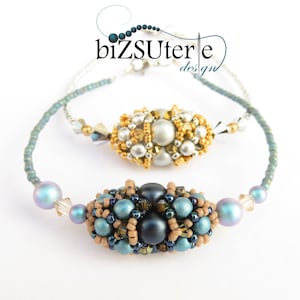 May include: Two beaded bracelets with a blue, brown and black colour scheme. The bracelets feature a cluster of beads in the centre of each bracelet.