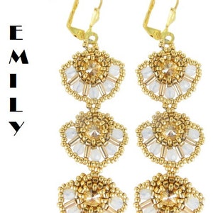 May include: Gold tone earrings with three tiers of white and gold beads in a fan shape.