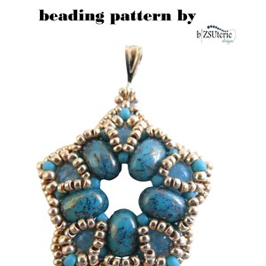 May include: A turquoise and gold beaded star pendant with a loop at the top for hanging. The pendant is made with small seed beads and larger turquoise beads with a marbled effect. The beading pattern is called "Vita" by "bZSuterie designs".