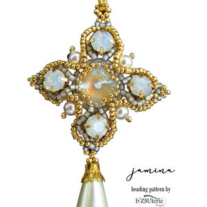 May include: A beaded pendant in a cross shape, featuring gold, silver, and iridescent beads. The pendant has a large central crystal and smaller opalescent stones. A pear-shaped pearl hangs from the bottom. The text "jamina" and "beading pattern by b'ZSUterie design" are visible.