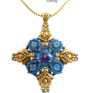 May include: A gold chain necklace with a blue and gold pendant featuring a large blue crystal in the center. The pendant is beaded and has a geometric design. The text "SHIMONA beading pattern by b'ZSuterie design" is visible at the top of the image.