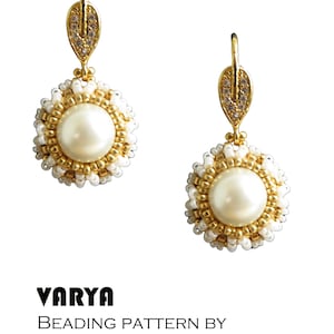 May include: A pair of gold earrings with a white pearl bead and a leaf-shaped dangle with clear rhinestones. The earrings are beaded with white and gold beads. The text "VARYA BEADING PATTERN BY bizSutterie" is below the earrings.