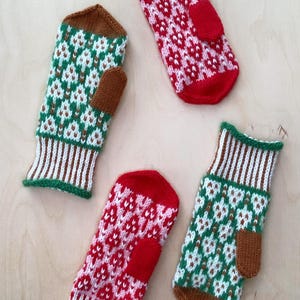 May include: Four pairs of knitted mittens with a geometric pattern in red, white, green, and brown. The mittens have a thumb hole and a separate finger section.