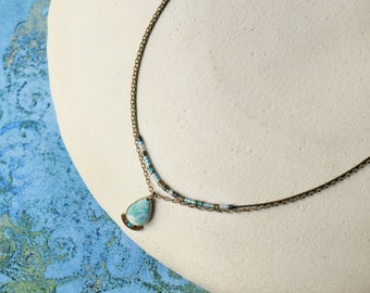 Double row brass necklace with drop pendant and celadon beads, Kalimeris collection