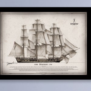 May include: A black and white drawing of the HMS Surprise, a British frigate, with the text "HMS Surprise 1796" below the ship. The drawing is framed in black.