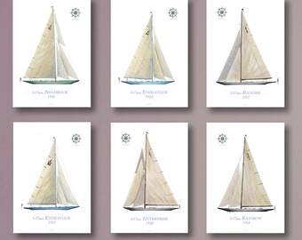 May include: Six vintage J-Class sailing yacht illustrations. Each illustration features a different yacht with its name and year of construction. The yachts are depicted in a white background with a compass rose in the top right corner.