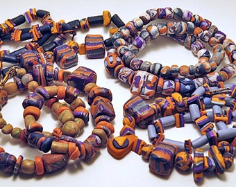 Necklace. Unique handmade beaded necklaces. Purple, mauve and orange ochre combined in unusual designs.