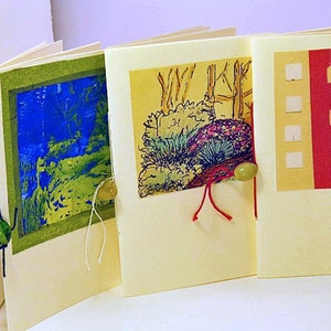 Blank Books. Small folded books with stitching and beads. Folded page books for gifts and group greeting cards. Unique designs. Cream paper.