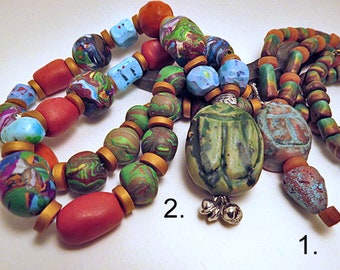 Beaded Necklace. Scarab beetle beads focus beads in two styles. Unique hand made set of beads with Egyptian inspired charm.