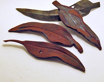 Brooches. Rusty gum leaf design. Unique hand made brooches or home decor objects copied from real gum leaves.