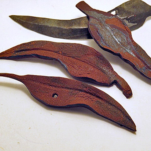 Brooches. Rusty gum leaf design. Unique hand made brooches or home decor objects copied from real gum leaves.