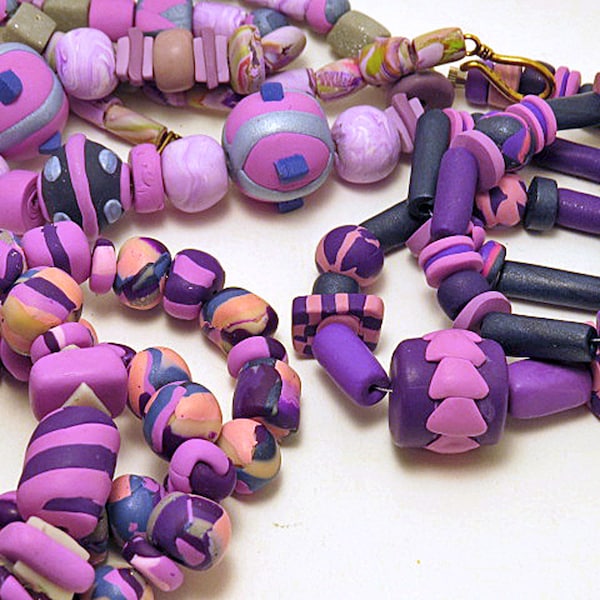 Beaded Necklace. Hand made beads in purple, mauve and pinks. Rustic beads.