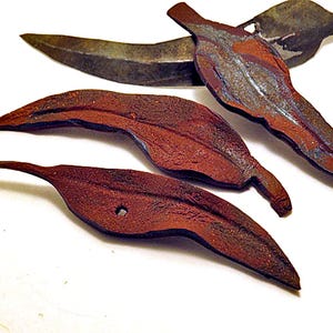 Brooches. Rusty gum leaf design. Unique hand made brooches or home decor objects copied from real gum leaves.