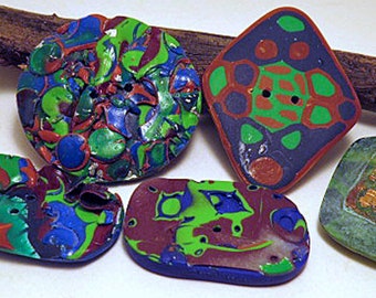 Buttons. Large decorative buttons with deep surface designs. Unique hand made buttons for crafts and clothing. Sold individually.