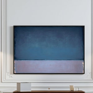 May include: A white room with a wooden console table with gold accents. The table has a white box and a glass of books on it. There are two black pendant lights hanging from the ceiling. A painting with a blue and pink color scheme hangs on the wall above the table. The floor is a herringbone pattern.
