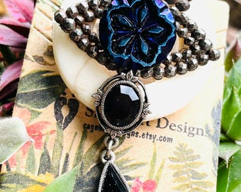 Cut steel and Iridescent Button Eye Brooch