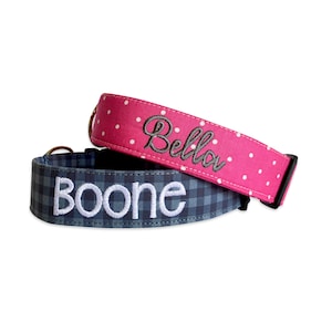 May include: Two dog collars, one pink with white polka dots and the name "Bella" embroidered in black, and one blue and white plaid with the name "Boone" embroidered in white.