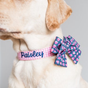 Add a touch of charm with the Duke & Fox® Pink Gingham Dog Collar. Handmade in Tennessee, this sweet pink checkered collar is perfect for any stylish pup. Personalize it with custom embroidery to feature your dog’s name for a one-of-a-kind look. Crafted with durable materials and quality hardware, it’s designed for comfort and everyday wear.