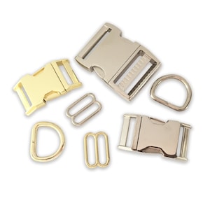 May include: Assortment of metal buckles and rings in gold and silver tones. The buckles are rectangular with a side release clasp. The rings are round and oval shaped.