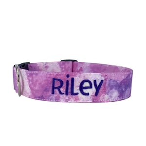 May include: Purple and white tie-dye dog collar with the name "Riley" embroidered in purple.