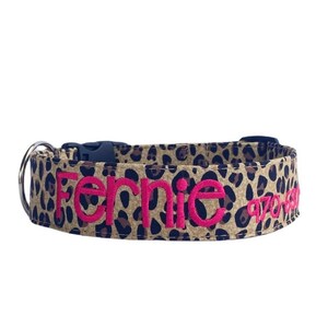 Show off your pup’s wild side with this personalized leopard print dog collar from Duke & Fox®. Handmade in Tennessee, this stylish collar features your dog’s name and contact info embroidered for a bold, custom look. Perfect for everyday wear or special outings, it combines fashion and function with durable materials and a comfortable fit—ideal for trendy dogs who love to stand out.