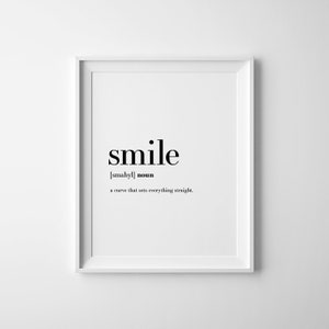 May include: Black and white typography print with the word "smile" defined as "a curve that sets everything straight".