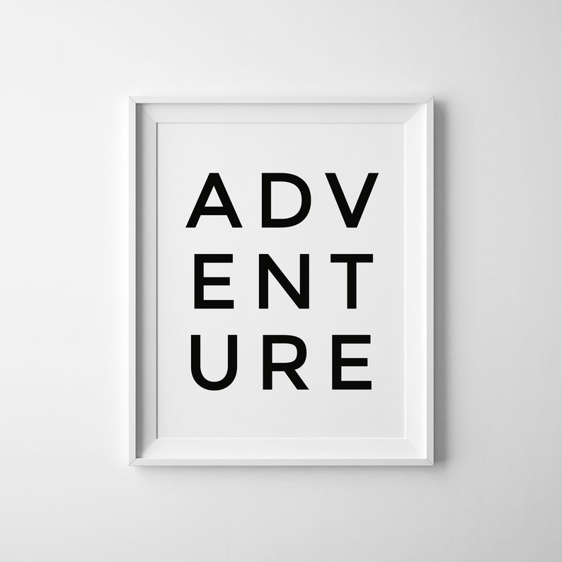 May include: A white framed print with the word "ADVENTURE" in black letters.