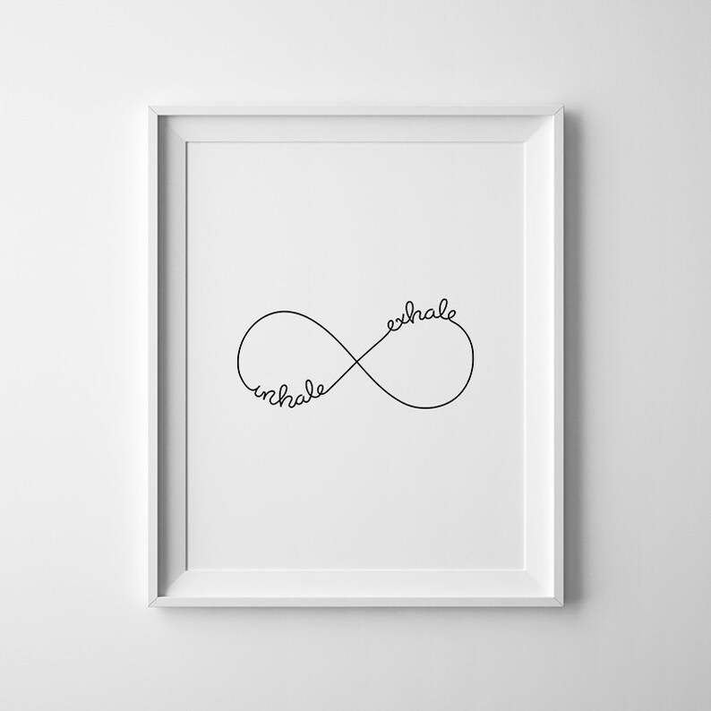May include: A black and white print featuring the words "inhale" and "exhale" written in a cursive font within an infinity symbol.