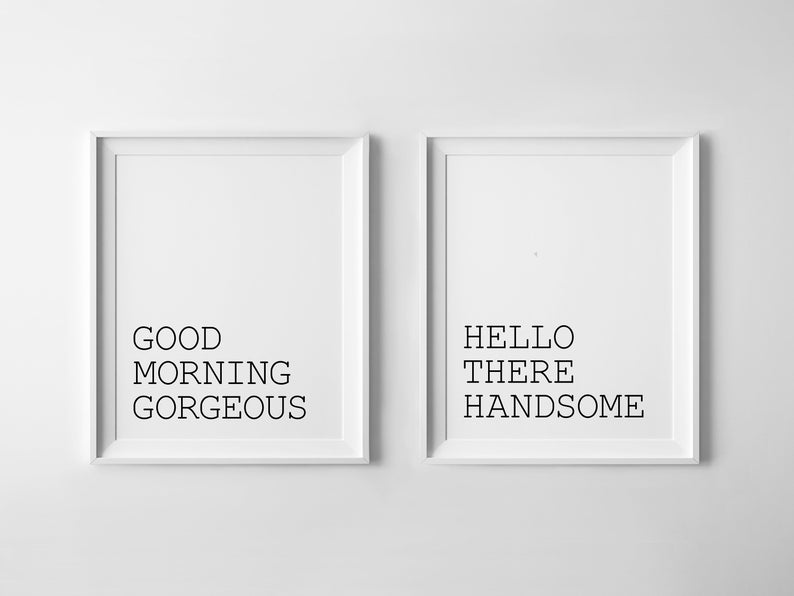 May include: Two white framed prints with black text. The left print says "GOOD MORNING GORGEOUS" and the right print says "HELLO THERE HANDSOME".