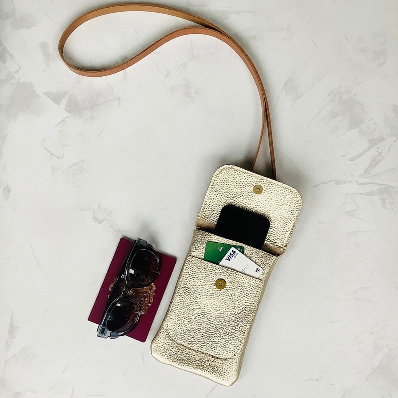 Champagne gold metallic leather smartphone bag with a crossbody strap