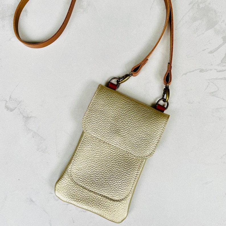 Champagne gold metallic leather smartphone bag with a crossbody strap