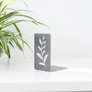 Steel Branch bookend for organizing books. Branch silhouette cut out from metal rectangle